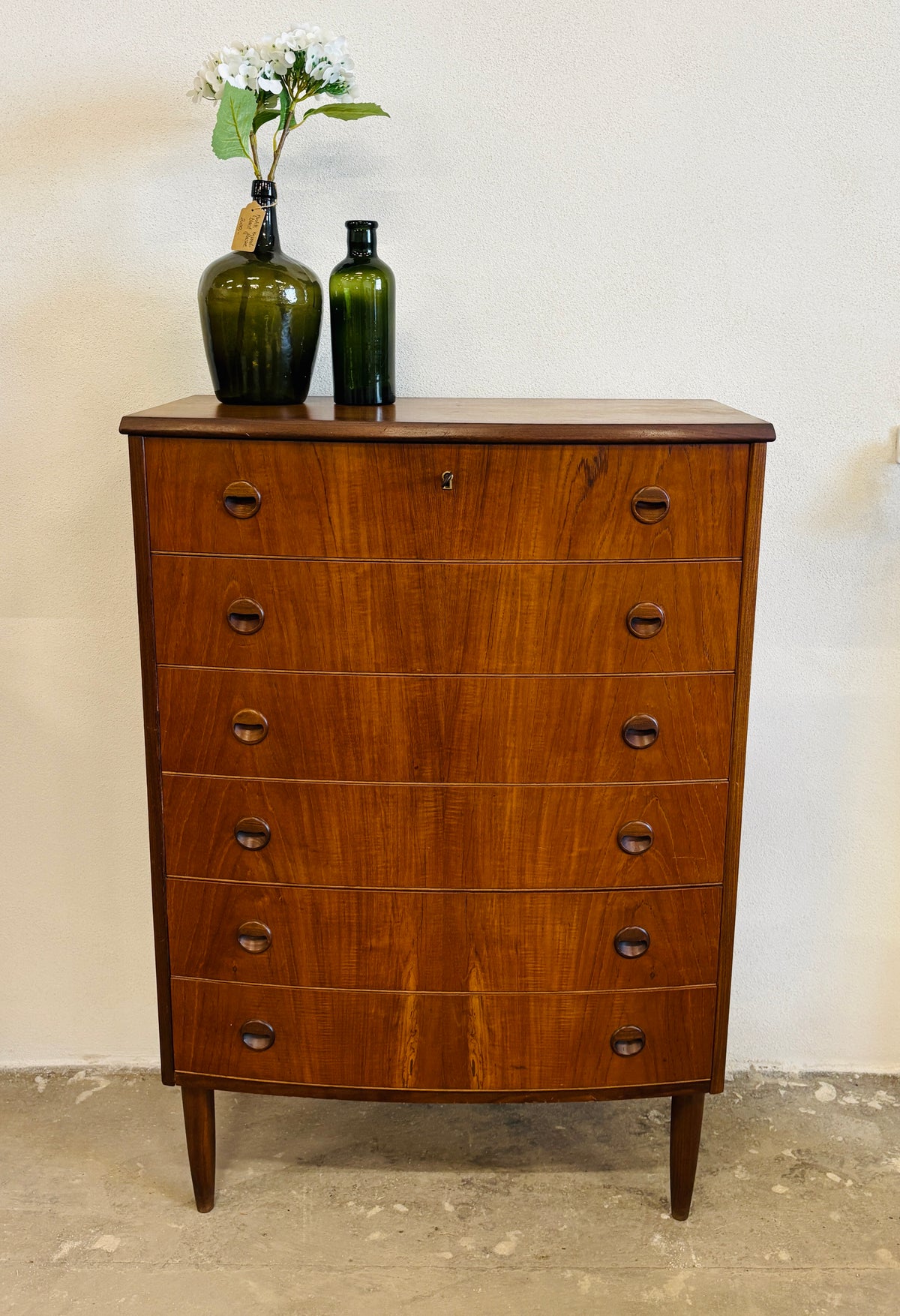 Teak chest of drawers with curved front
