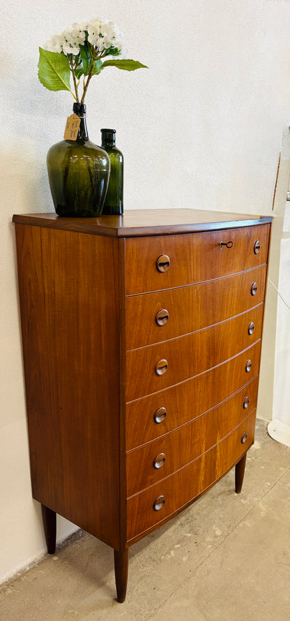Teak chest of drawers with curved front
