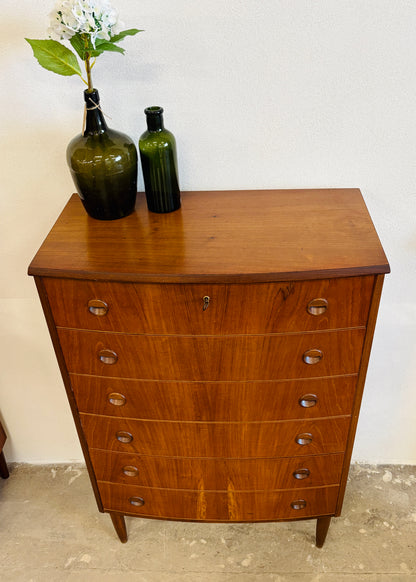 Teak chest of drawers with curved front