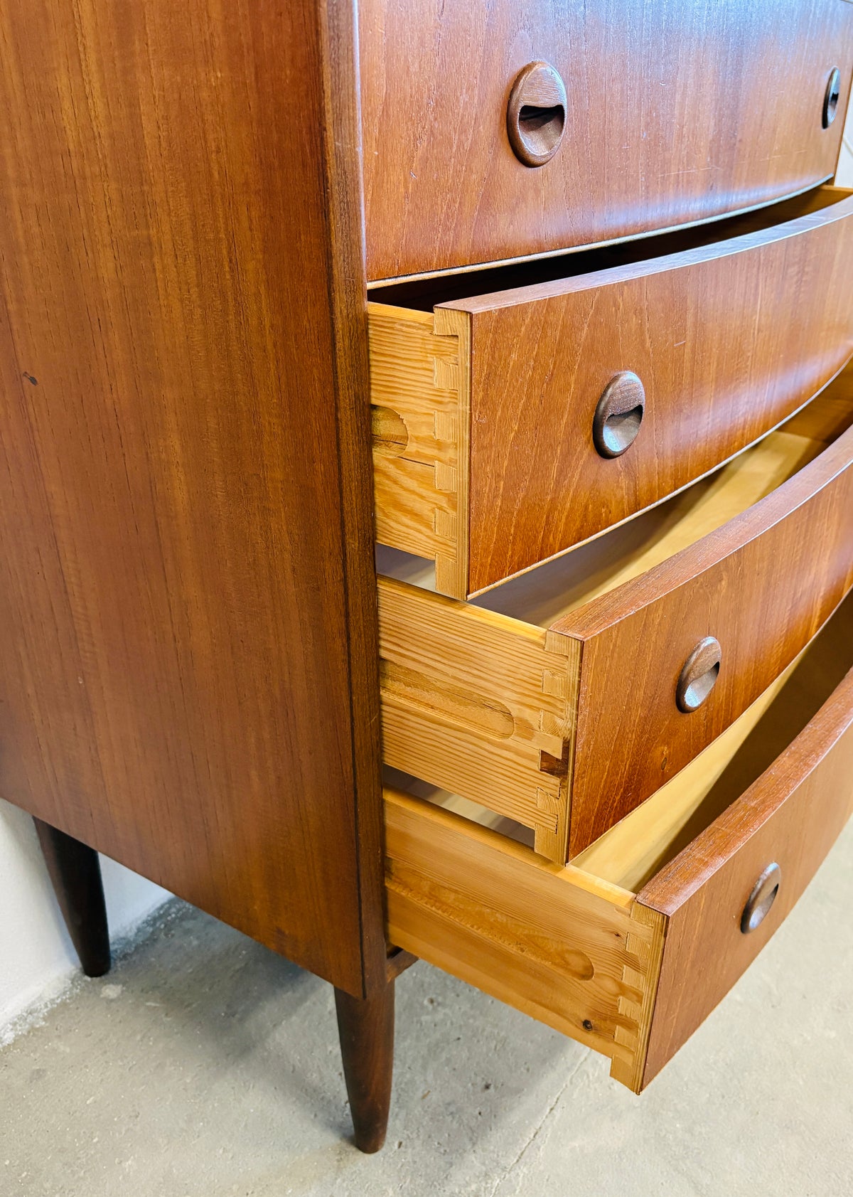 Teak chest of drawers with curved front