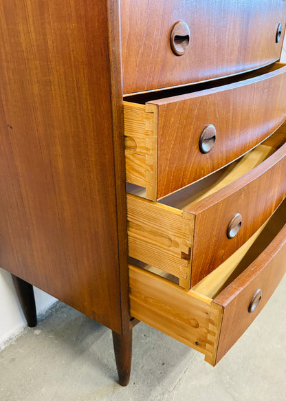 Teak chest of drawers with curved front